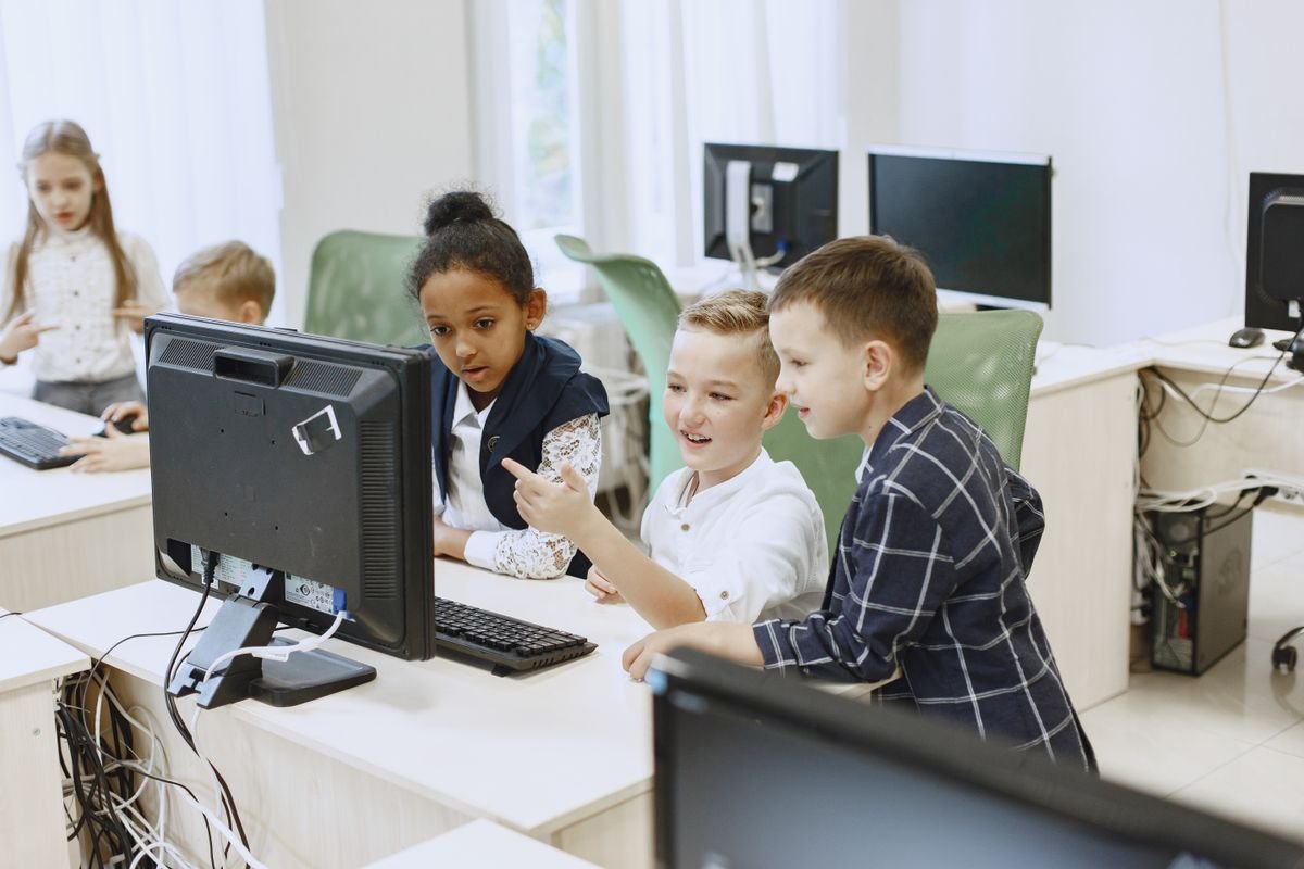 Illustrative stock photo of children learning together at a computer
